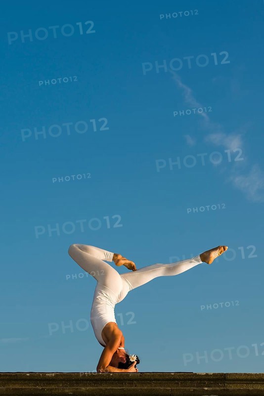 Young woman practising Hatha yoga