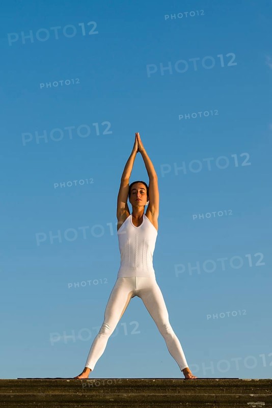 Young woman practising Hatha yoga
