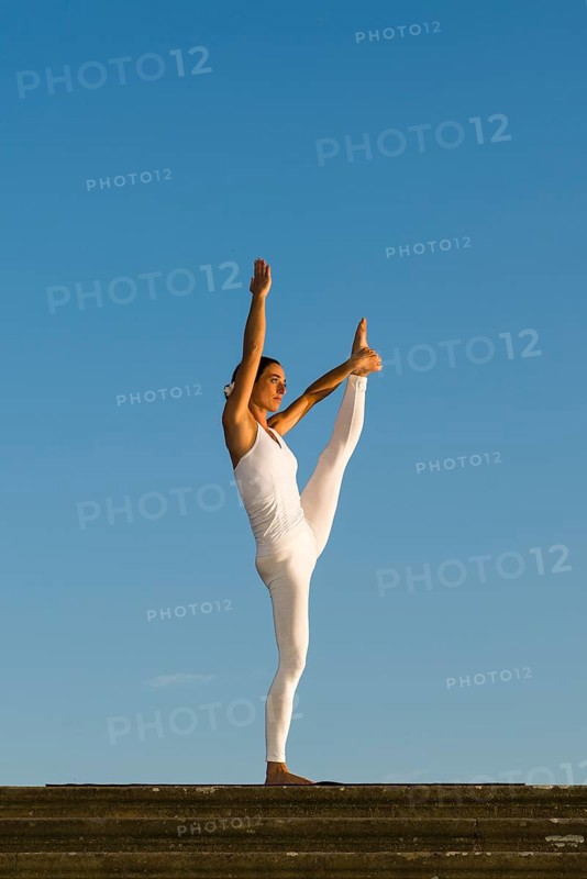 Young woman practising Hatha yoga