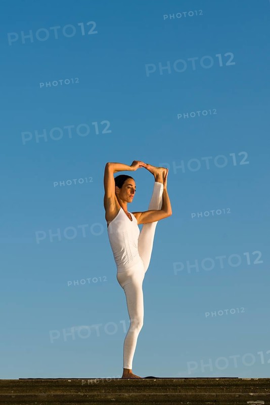 Young woman practising Hatha yoga