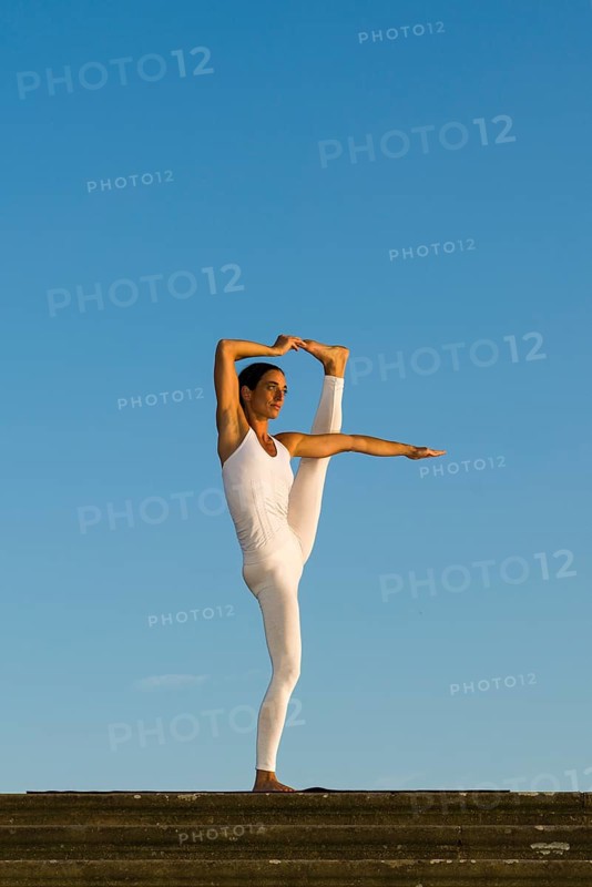Young woman practising Hatha yoga