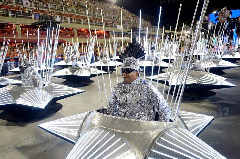Wheelchair users take part in the parade of the samba school Inocentes de Belford Rocho