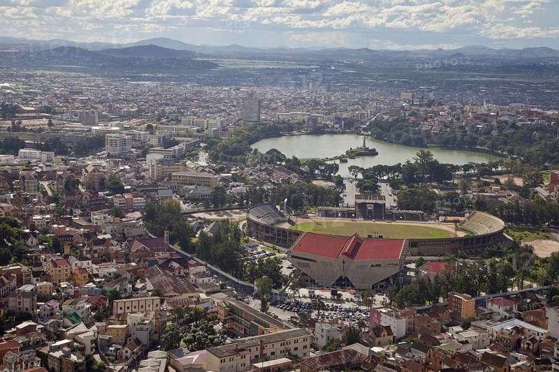 View of city with sports stadium and lake