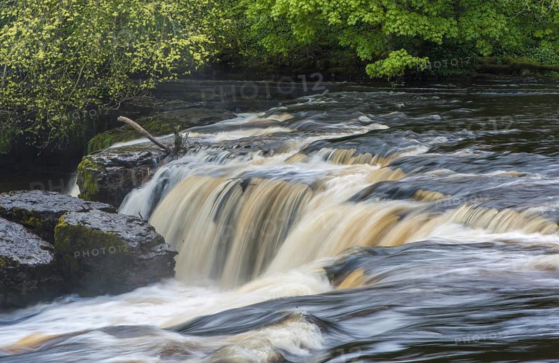 View of river and waterfall