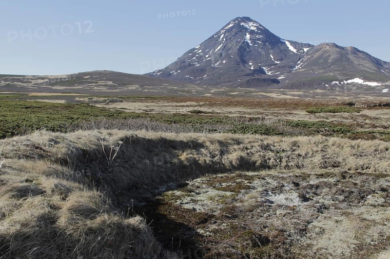 Foundations of Ainu dwelling and tundra on volcanic island
