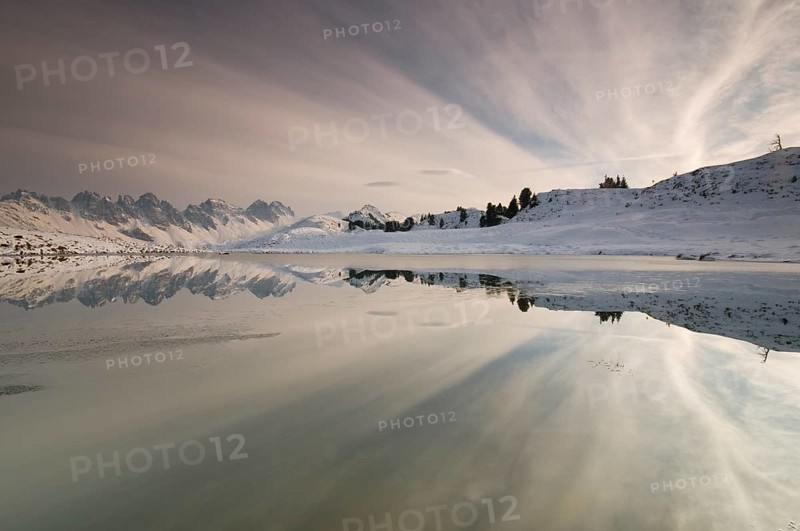 Kalkkoegel mountain range reflected in a small lake