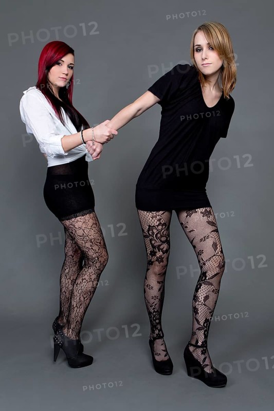 Two young women wearing short dresses