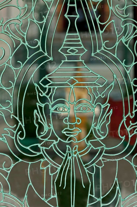 Metal mesh gate with a representation of Buddha in the Royal Palace
