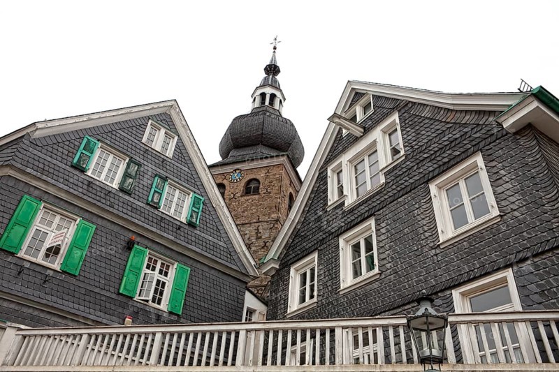Protestant parish church with houses with slate fronts in the historic town centre of Lennep