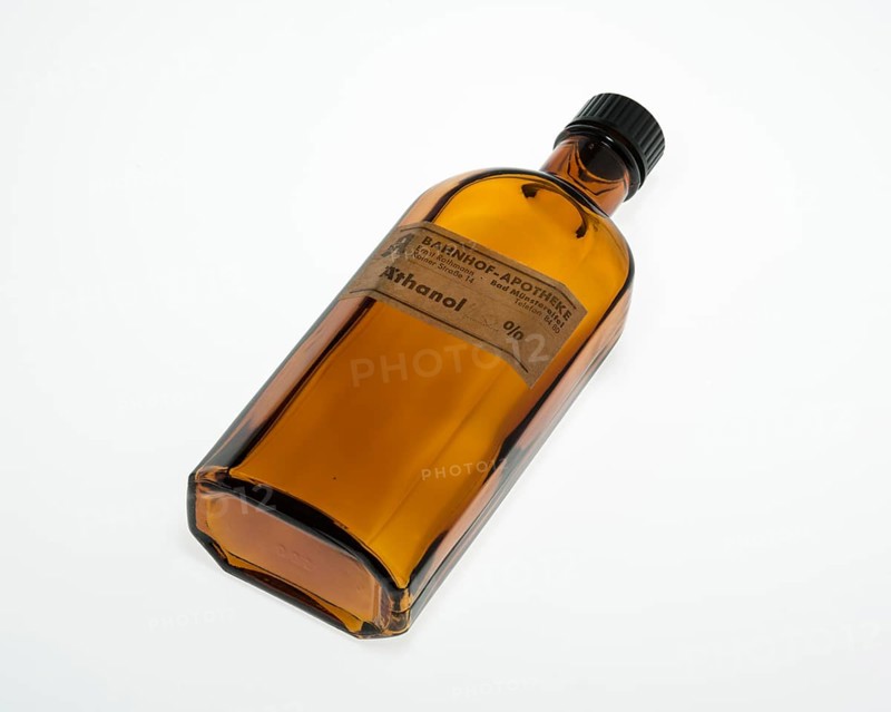 Lying empty brown bottle