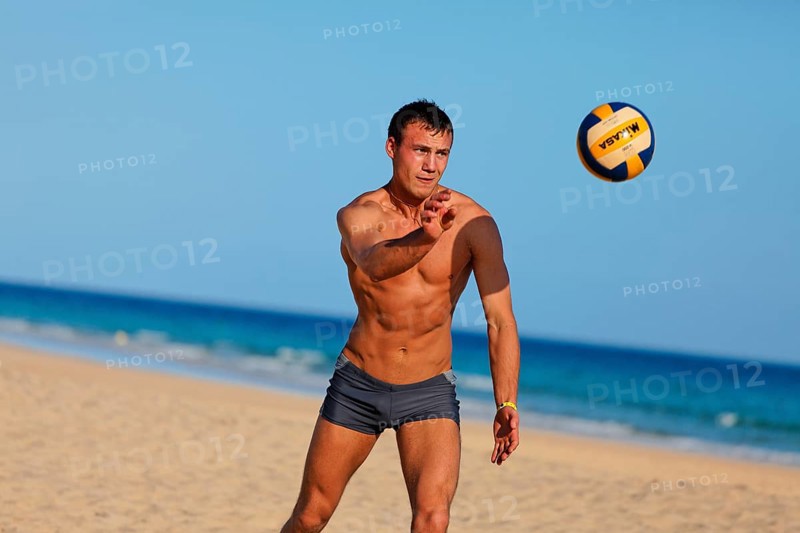 Man playing beach volleyball