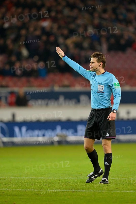 Referee Dr. Felix Brych awarding a free kick