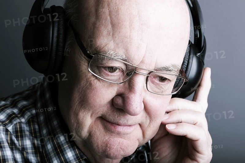 Senior wearing headphones