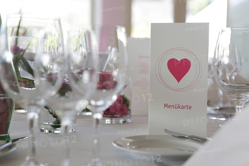 Table decorations and menu cards at a wedding reception