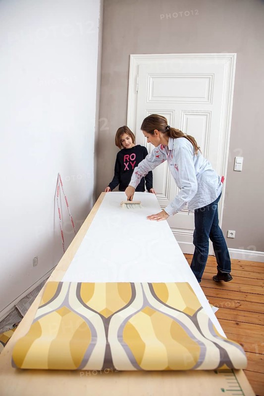 Mother and daughter renovating a room