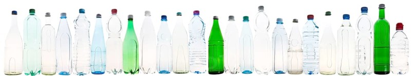 Different varieties of mineral water in bottles made of glass and plastic or PET