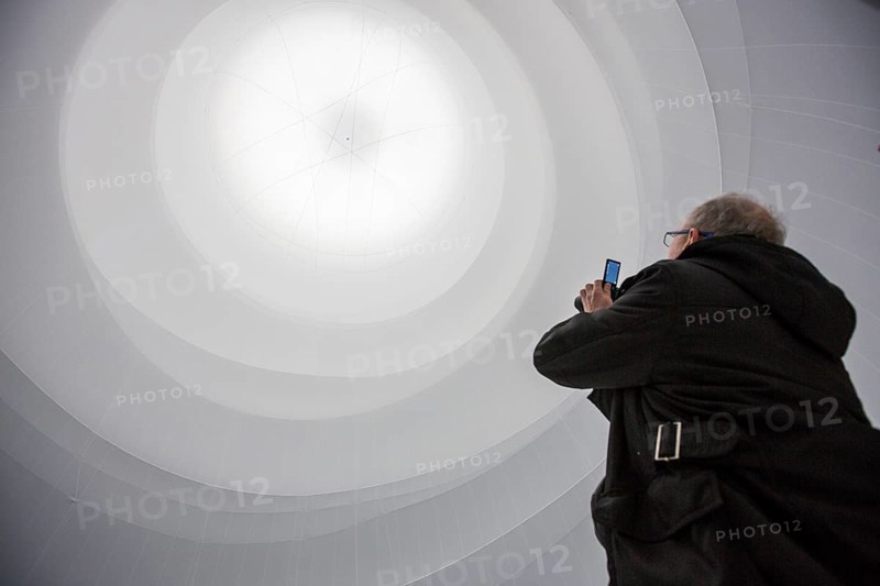 Visitor taking a picture of an installation by Christo