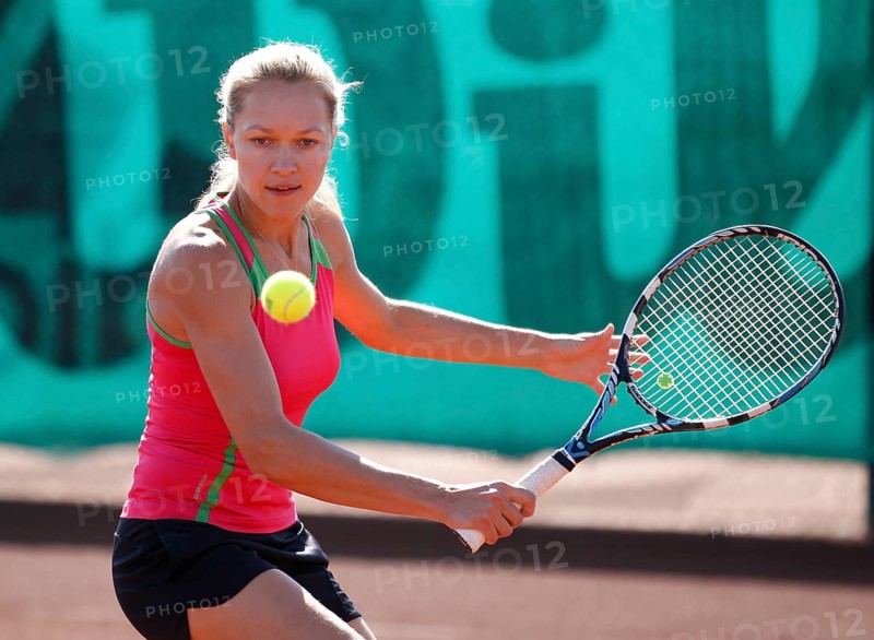 Young woman playing tennis in a holiday club