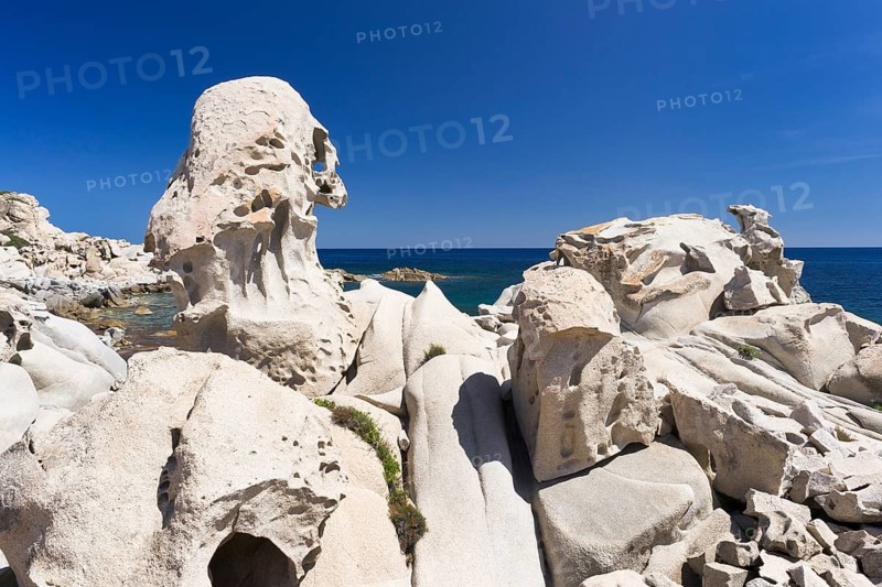 Eroded granite rocks on the beach of Punta Molentis