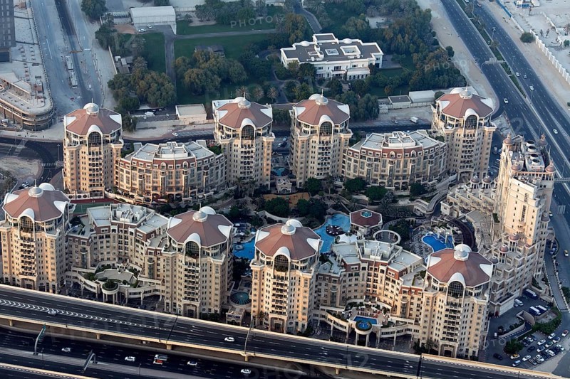 View from Burj Khalifa over a residential complex with luxury apartments and pool areas
