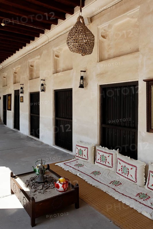 Veranda with a seating area on the ground