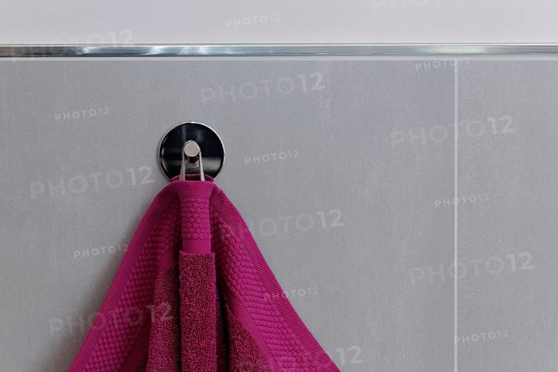 Berry-colored towel hanging on a hook