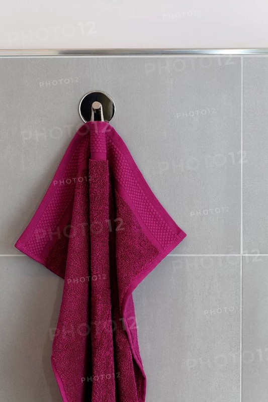 Berry-colored towel hanging on a hook