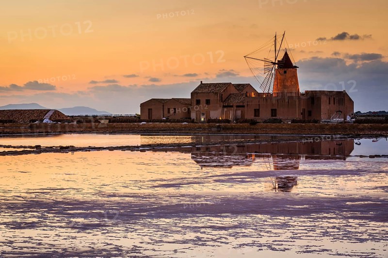 Sunset at the old saltworks in the Laguna dello Stagnone near Trapani