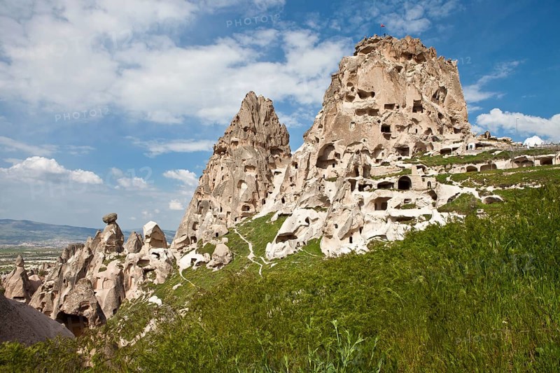 Fortress of Uchisar surrounded by Fairy Chimneys made of tufa