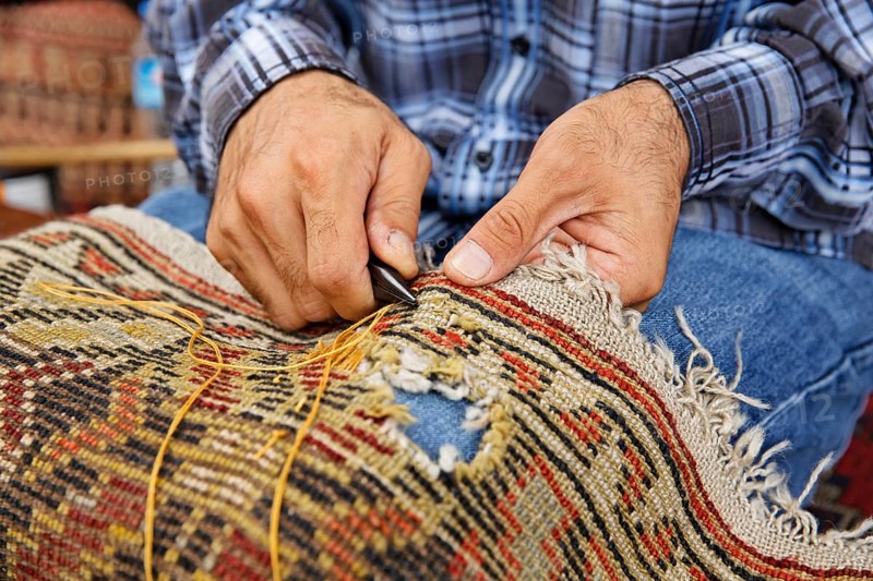 Man patching a carpet