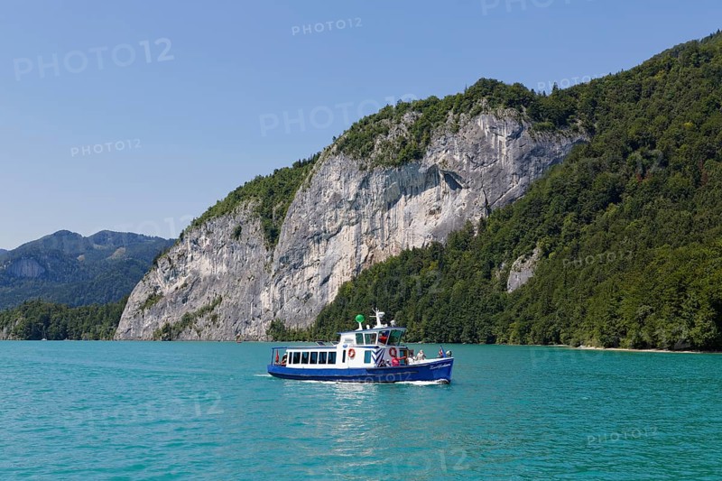 Passenger ship Zwoelferhorn in front of rock wall of Falkenstein