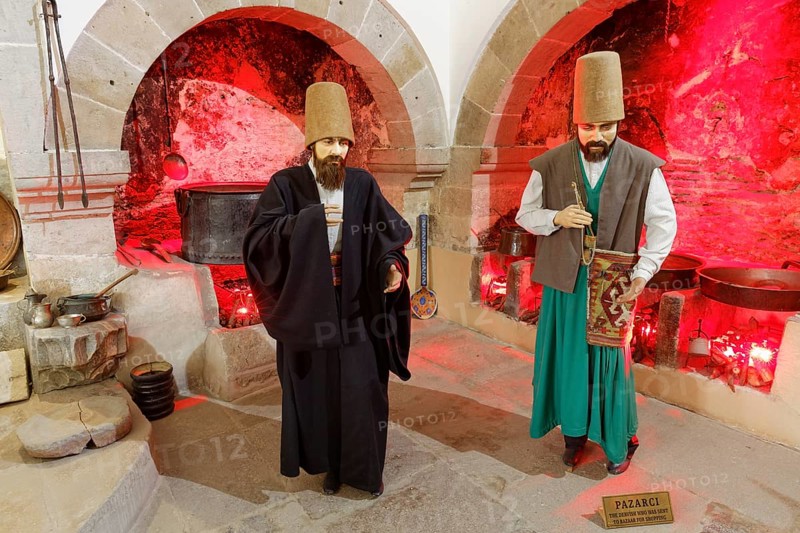 Life-size figures of dervishes in the bazaar