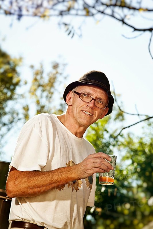 Man with freshly squeezed apple juice