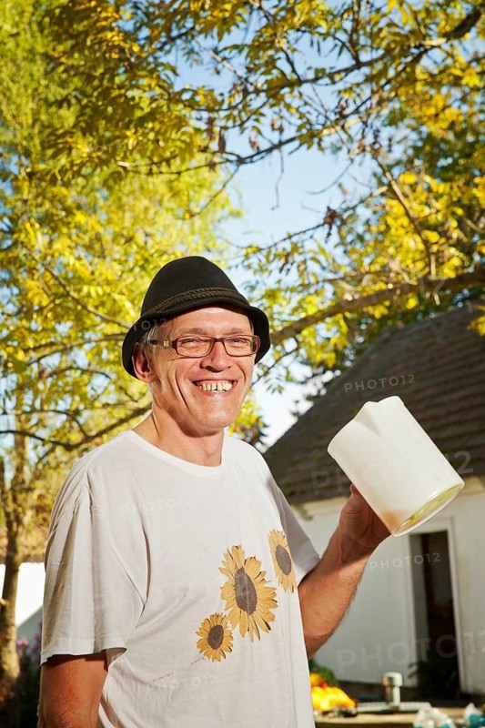 Man with freshly squeezed apple juice