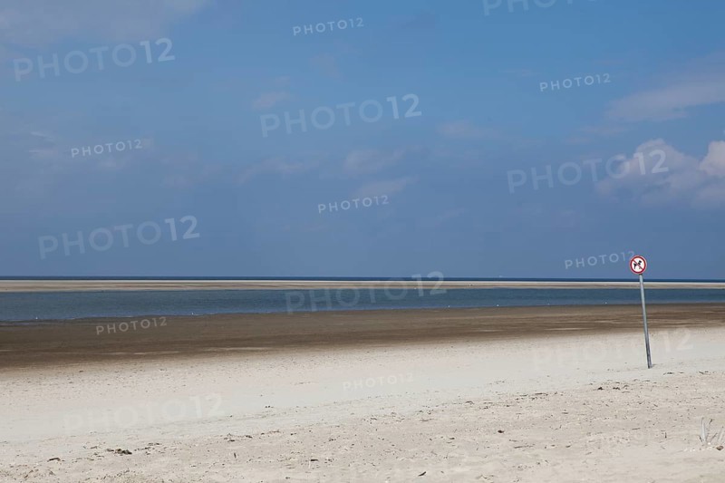 Deserted beach with a dogs prohibition sign on the island of Langeoog