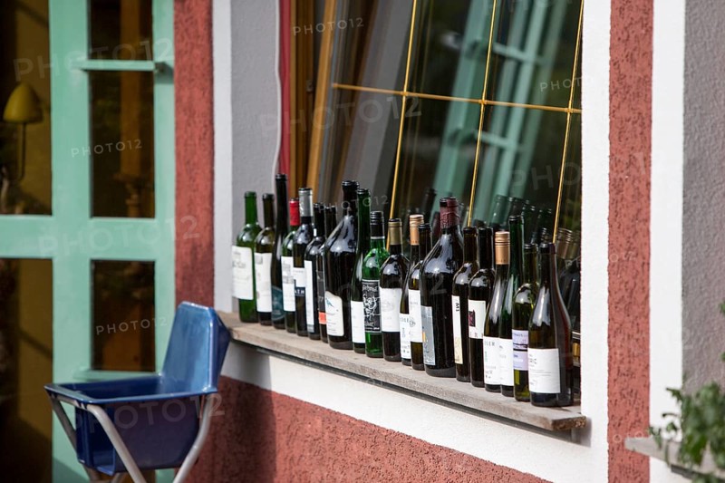 Empty wine bottles on the window sill of a restaurant