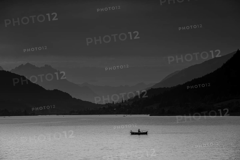 View over Weissensee lake towards Techendorf in the evening light