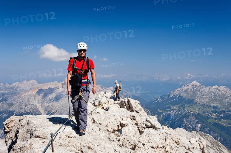 Climber on the way down from the summit of Cristallo di Mezzo mountain