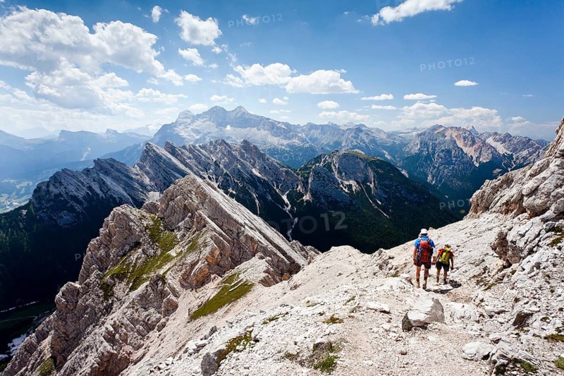 Hikers on their way down from the summit of Cristallino mountain