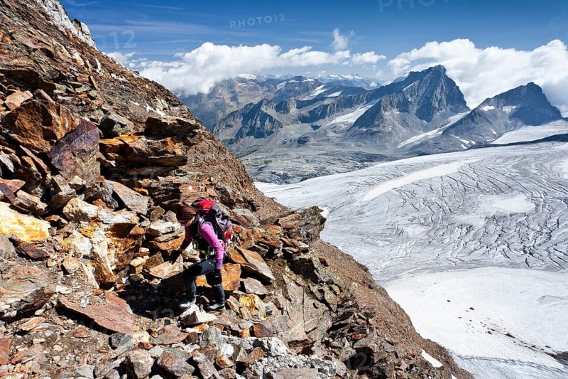 Mountain climber ascending Schneebiger Nock Mountain