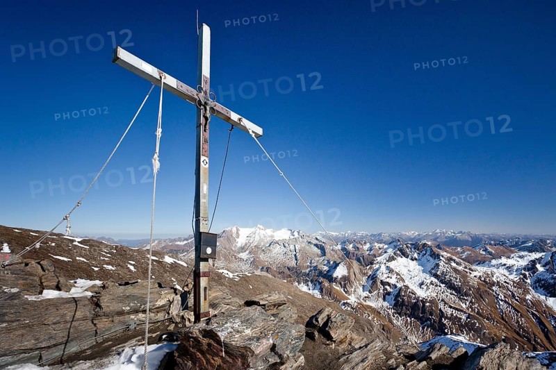 Summit cross on the summit of Wilden Kreuzspitze Mountain in the Pfunderer Mountains