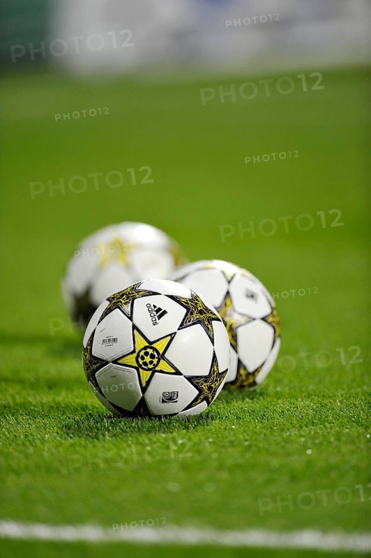 Three footballs