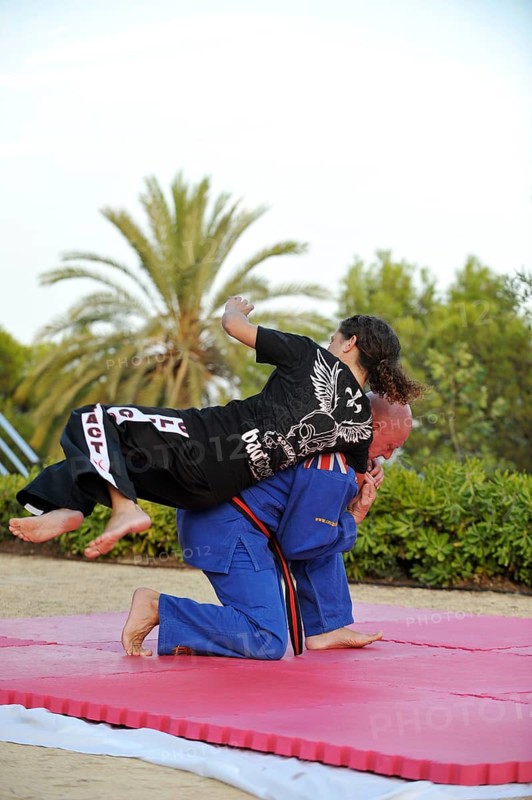 Woman and a man doing martial arts training in a park