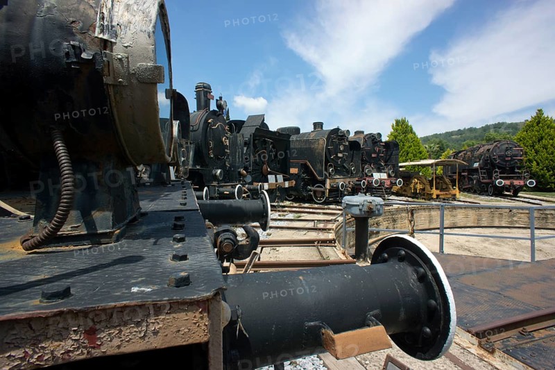4 locomotives standing in front of the turntable