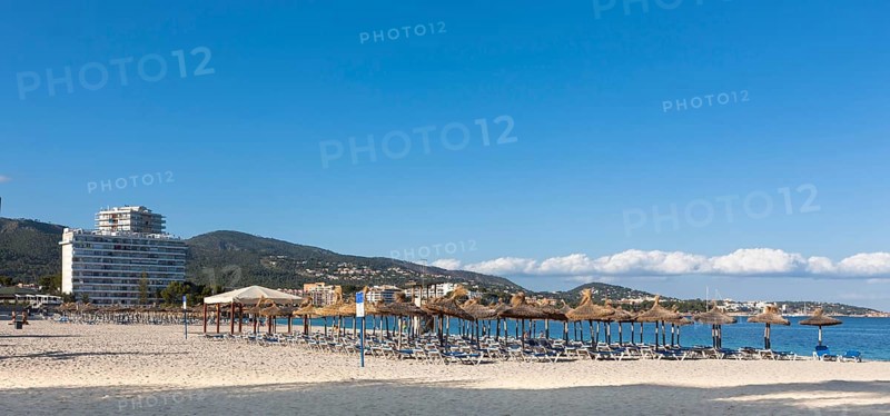 Section of beach near Palma Nova with sunbeds and hotels