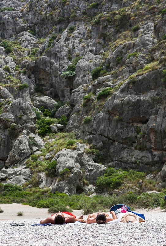 Tourists sunbathing in Torrent de Pareis Gorge
