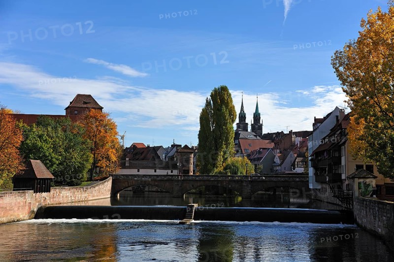 View from Kettensteg bridge past Maxbruecke bridge towards the Church of St. Lawrence