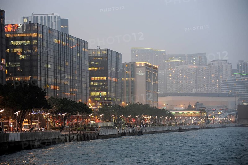 View of skyscrapers and Victoria Harbour in the evening