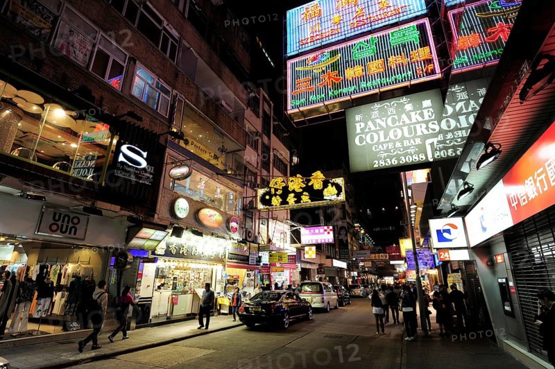 Neon signs on a street in Tsim Sha Tsui at night