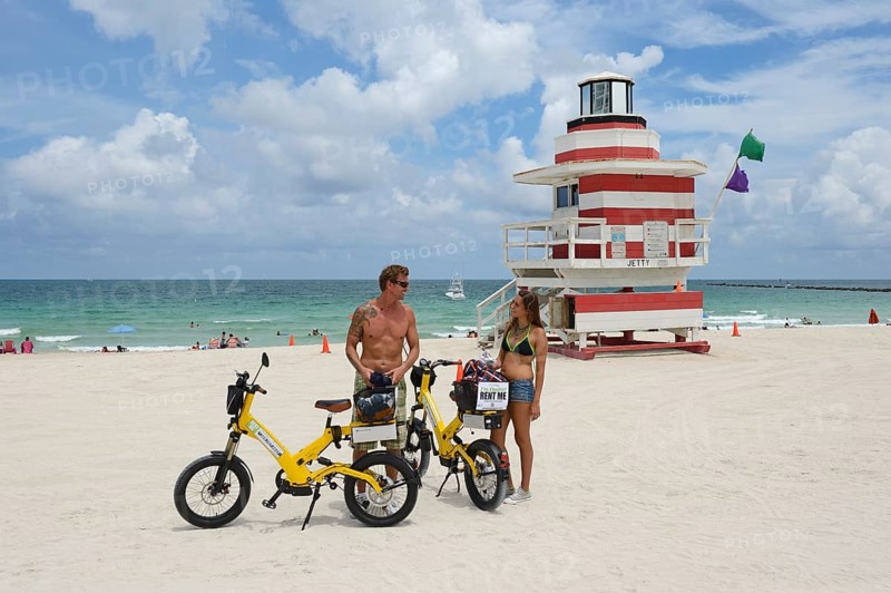 Couple riding electric bicycles